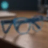 Stylish blue light blocking glasses on a desk