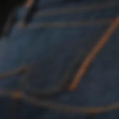 Detailed view of precision stitching on pocket of jeans