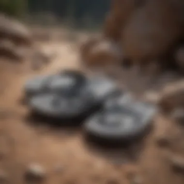 Pair of durable thick foam flip flops on rocky terrain