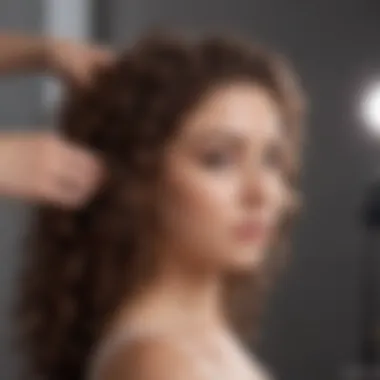 A hand applying curl mousse on curly hair