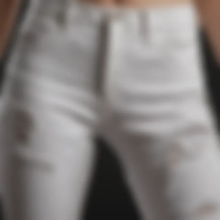 Close-up of the ripped details on white mom jeans