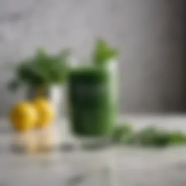 Vibrant green juice in a glass on a marble table