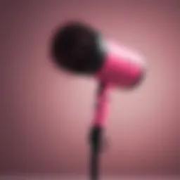Elegant pink and black blow dryer brush with sleek design
