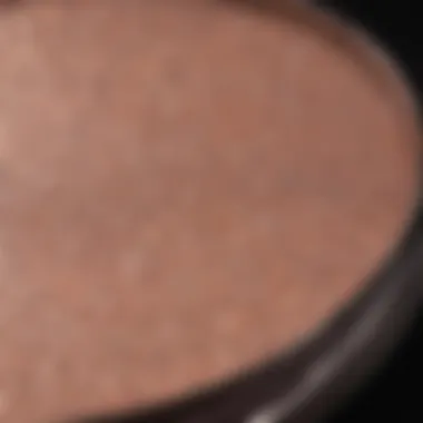 A close-up of a shimmering highlighter product reflecting light.