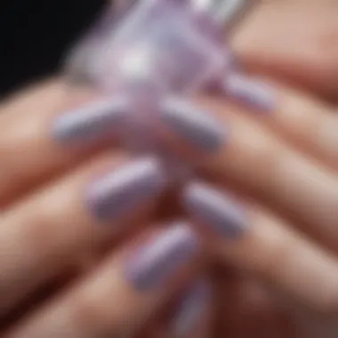 Close-up of perfectly manicured nails with holographic glitter accents