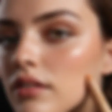 Close-up of a concealer sponge stick in action, blending seamlessly on skin.