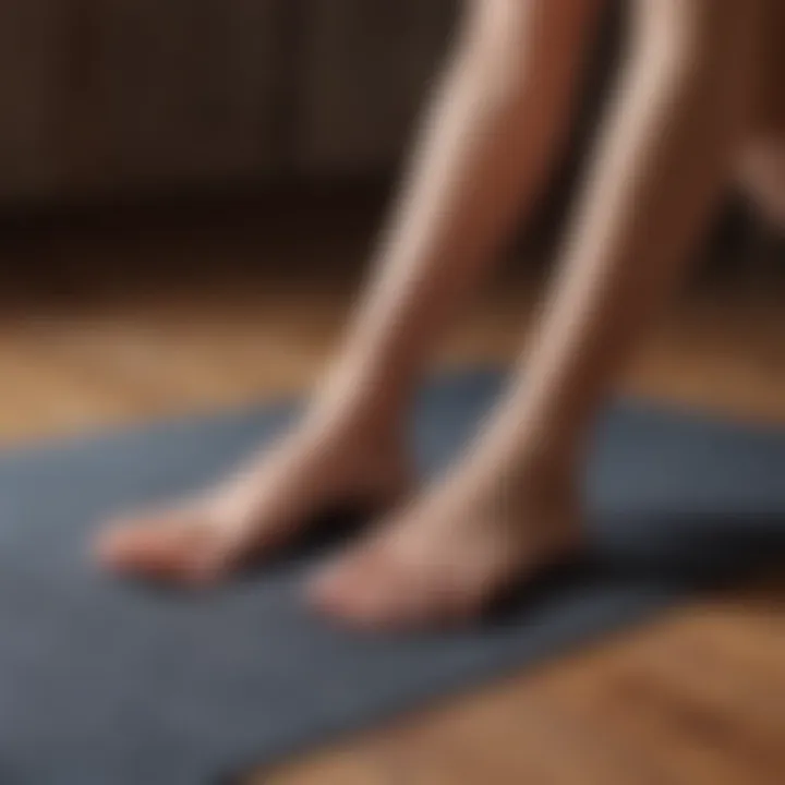 Sculpted legs on a yoga mat