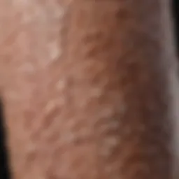 Close-up view of dry, scaly skin on a forearm.