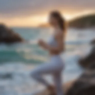 Woman practicing vinyasa posture by the ocean